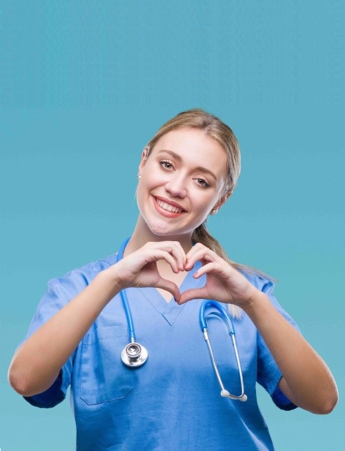 Smiling nurse making a heart shape with her hands